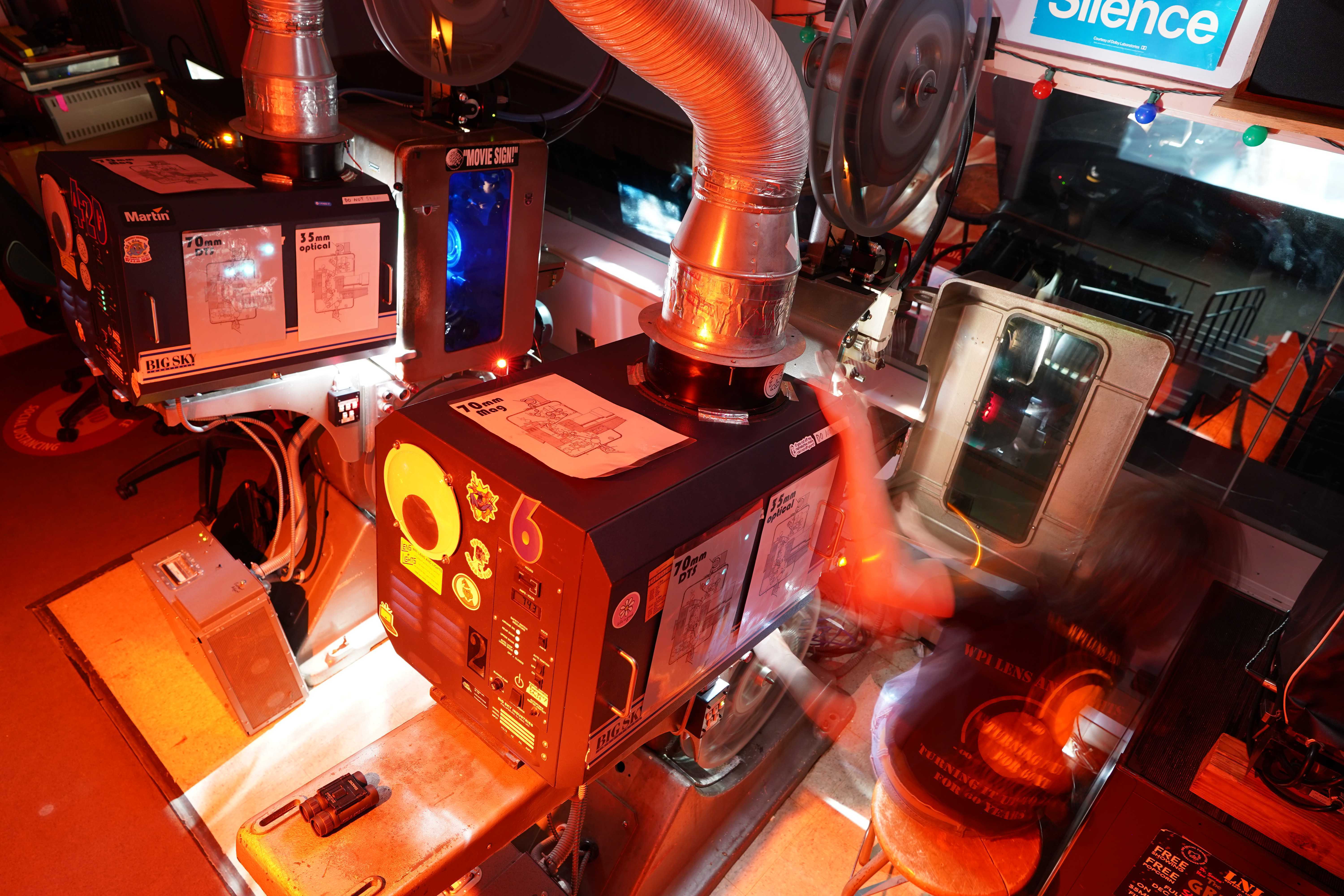 Close-up of film reels on a projector in the LNL booth